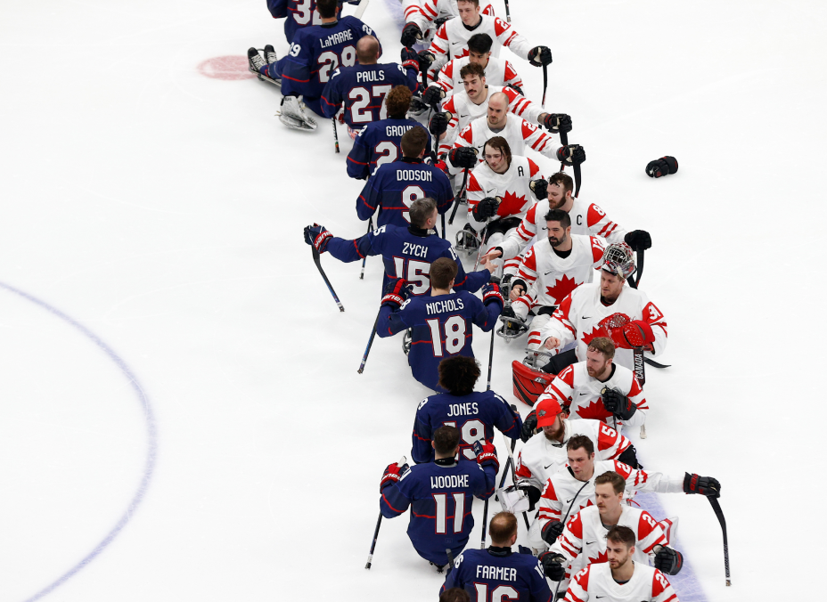 The U.S. and Canadian Men's Sled Hockey Team shake hands after a match at the Tokyo 2020 Paralympic Games.