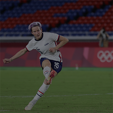 Megan Rapinoe takes a shot on goal during a Women's Soccer Olympic match at the Tokyo Games.